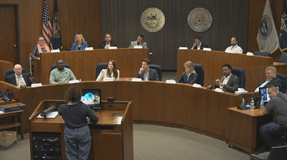 Alex O'Hanlon presenting recommendations to the Omaha City Charter Convention in the chambers of the Omaha City Council