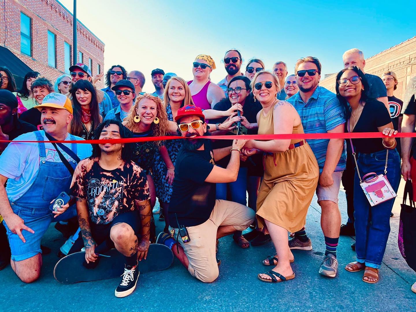 The Benson Creative District ribbon cutting in July 2022 on Maple Street in Omaha.