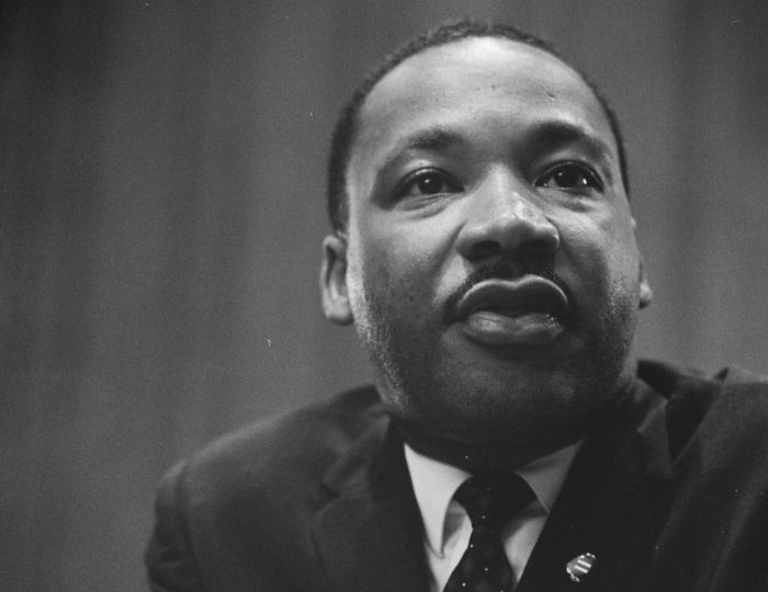 Martin-Luther-King-1964-leaning-on-a-lectern